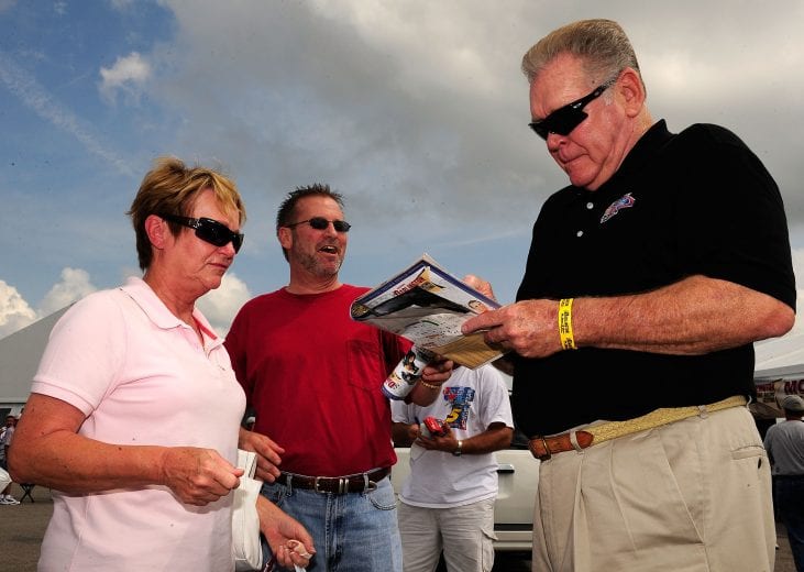 DARLINGTON, SC - AUGUST 31: Television personality and former driver Buddy Baker signs autographs for fans during the Darlington Vintage Racing Festival at Darlington Raceway on August 31, 2008 in Darlington, South Carolina. (Photo by Rusty Jarrett/Getty Images) | Getty Images