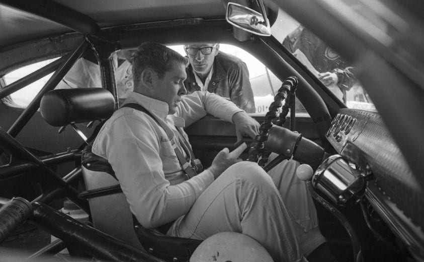 DAYTONA BEACH, FL - FEBRUARY 24: Driver Buddy Baker talks with owner Ray Fox while sitting in his 1967 Dodge at The Daytona 500 on February 24, 1967 at the Daytona International Speedway in Daytona Beach, Florida. Baker finishes 4th. (Photo by Dozier Mobley/Getty Images)