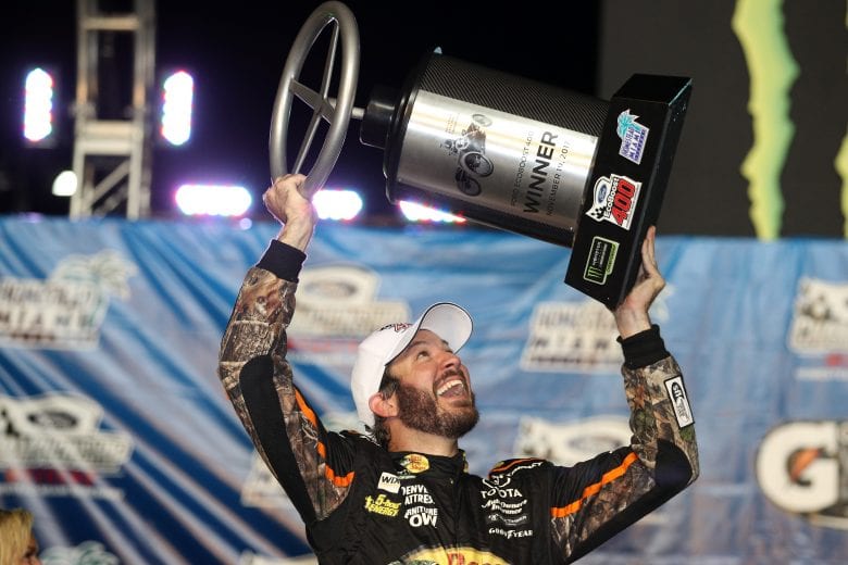 HOMESTEAD, FL - NOVEMBER 19: Martin Truex Jr., driver of the #78 Bass Pro Shops/Tracker Boats Toyota, celebrates with the race trophy after winning the Monster Energy NASCAR Cup Series Championship and the Monster Energy NASCAR Cup Series Championship Ford EcoBoost 400 at Homestead-Miami Speedway on November 19, 2017 in Homestead, Florida. (Photo by Chris Graythen/Getty Images) | Getty Images
