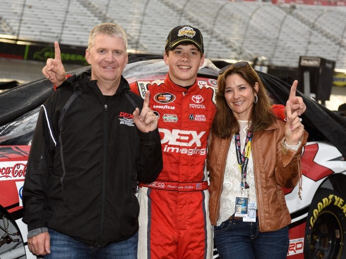 BRISTOL, TN - APRIL 22: Harrison Burton, driver of the #12 Dex Imaging Toyota, poses for a photo with his father, Jeff Burton, (L) and mother, Kim Burton, after winning the NASCAR K&N Pro Series East Zombie Motors 125 at Bristol Motor Speedway on April 22, 2017 in Bristol, Tennessee. (Photo by Jared C. Tilton/Getty Images) | Getty Images