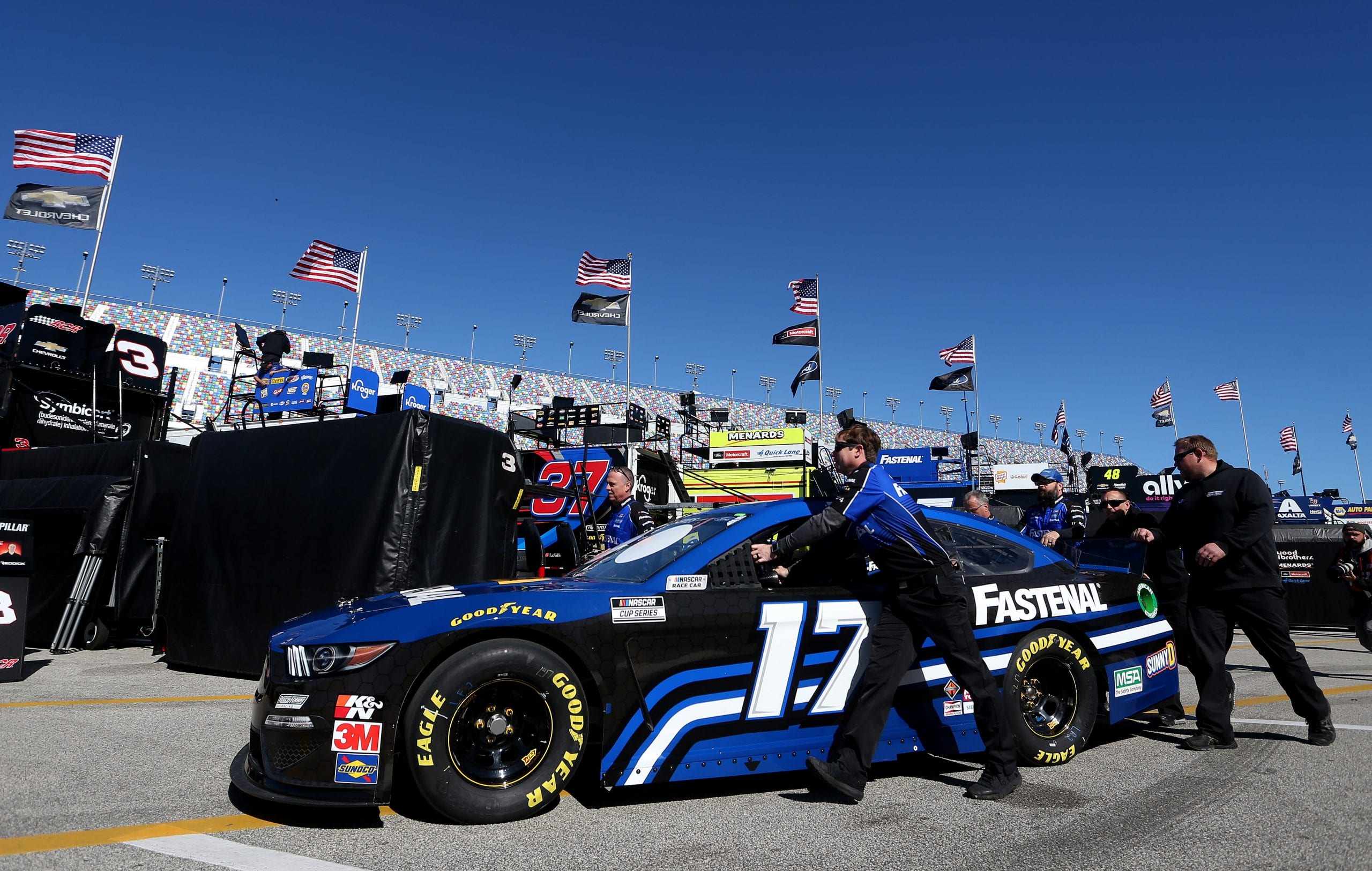 DAYTONA BEACH, FLORIDA - FEBRUARY 08: Chris Buescher, driver of the #17 Fastenal ForChris Buescher, driver of the #17 Fastenal Ford, is pushed through the garage area during practice for the NASCAR Cup Series Busch Clash at Daytona International Speedway on February 08, 2020 in Daytona Beach, Florida. (Photo by Brian Lawdermilk/Getty Images) | Getty Images
