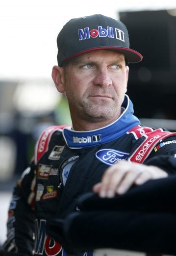 DAYTONA BEACH, FLORIDA - FEBRUARY 08: Clint Bowyer, driver of the #14 Rush/Mobil 1 Ford, stands in the garage area during practice for the NASCAR Cup Series 62nd Annual Daytona 500 at Daytona International Speedway on February 08, 2020 in Daytona Beach, Florida. (Photo by Brian Lawdermilk/Getty Images) | Getty Images