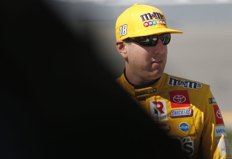 DAYTONA BEACH, FLORIDA - FEBRUARY 09: Kyle Busch, driver of the #18 M&M's Toyota, stands on the grid during qualifying for the NASCAR Cup Series 62nd Annual Daytona 500 at Daytona International Speedway on February 09, 2020 in Daytona Beach, Florida. (Photo by Brian Lawdermilk/Getty Images) | Getty Images