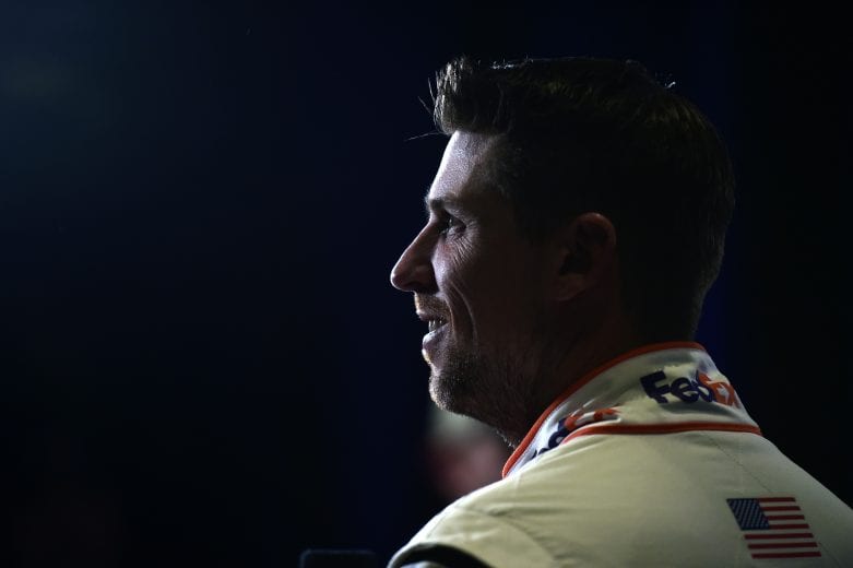 DAYTONA BEACH, FLORIDA - FEBRUARY 12: Denny Hamlin, driver of the #11 FedEx Express Toyota, speaks with the media during the NASCAR Cup Series 62nd Annual Daytona 500 Media Day at Daytona International Speedway on February 12, 2020 in Daytona Beach, Florida. (Photo by Jared C. Tilton/Getty Images) | Getty Images