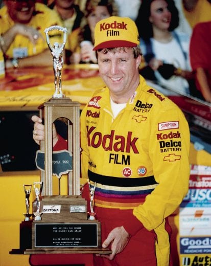 DAYTONA BEACH, FL - FEBRUARY 19, 1995:  Colorful winner Sterling Marlin enjoys taking consecutive Daytona 500 winning trophies after his victory in the 1995 race.  (Photo by ISC Archives/CQ-Roll Call Group via Getty Images)