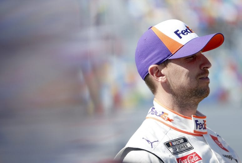 DAYTONA BEACH, FLORIDA - FEBRUARY 09: Denny Hamlin, driver of the #11 FedEx Express Toyota, stands on the grid during qualifying for the NASCAR Cup Series 62nd Annual Daytona 500 at Daytona International Speedway on February 09, 2020 in Daytona Beach, Florida. (Photo by Brian Lawdermilk/Getty Images) | Getty Images