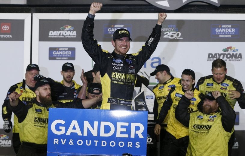 DAYTONA BEACH, FLORIDA - FEBRUARY 14: Grant Enfinger, driver of the #98 Champion/Curb Records Ford, celebrates in Victory Lane after winning the NASCAR Gander RV & Outdoors Truck Series NextEra Energy 250 at Daytona International Speedway on February 14, 2020 in Daytona Beach, Florida. (Photo by Brian Lawdermilk/Getty Images) | Getty Images