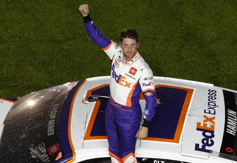 DAYTONA BEACH, FLORIDA - FEBRUARY 17: Denny Hamlin, driver of the #11 FedEx Express Toyota, celebrates after winning the NASCAR Cup Series 62nd Annual Daytona 500 at Daytona International Speedway on February 16, 2020 in Daytona Beach, Florida. (Photo by Brian Lawdermilk/Getty Images) | Getty Images