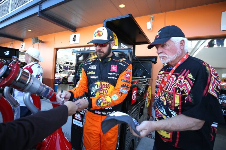 LAS VEGAS, NEVADA - FEBRUARY 21: Martin Truex Jr., driver of the #19 Bass Pro Shops Toyota, signs autographs during practice for NASCAR Cup Series Penzoil 400 presented by Jiffy Lube at Las Vegas Motor Speedway on February 21, 2020 in Las Vegas, Nevada. (Photo by Matt Sullivan/Getty Images) | Getty Images
