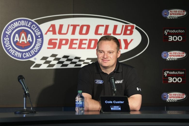 FONTANA, CALIFORNIA - FEBRUARY 28: Cole Custer, driver of the #41 Haas/Production Alliance Group Ford, speaks ahead of practice at Auto Club Speedway on February 28, 2020 in Fontana, California. (Photo by Meg Oliphant/Getty Images) | Getty Images