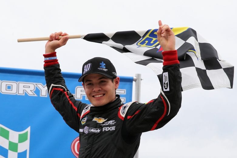 ROCKINGHAM, NC - APRIL 14:  Kyle Larson, driver of the #30 Autism Speaks Chevrolet, celebrates after winning the NASCAR Camping World Truck Series Carolina 200 at Rockingham Speedway on April 14, 2013 in Rockingham, North Carolina.  (Photo by Streeter Lecka/Getty Images) | Getty Images