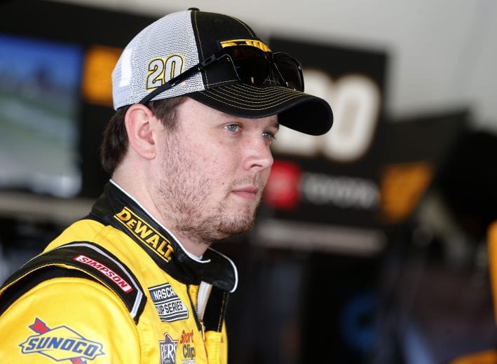 DAYTONA BEACH, FLORIDA - FEBRUARY 08: Erik Jones, driver of the #20 DEWALT Toyota, stands in the garage area during practice for the NASCAR Cup Series 62nd Annual Daytona 500 at Daytona International Speedway on February 08, 2020 in Daytona Beach, Florida. (Photo by Brian Lawdermilk/Getty Images) | Getty Images