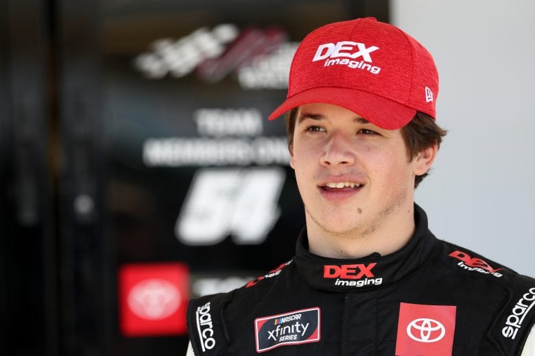 AVONDALE, ARIZONA - MARCH 06: Harrison Burton, driver of the #20 Dex Imaging Toyota, stands in the garage area during practice for the NASCAR Xfinity Series LS Tractor 200 at Phoenix Raceway on March 06, 2020 in Avondale, Arizona. (Photo by Chris Graythen/Getty Images) | Getty Images