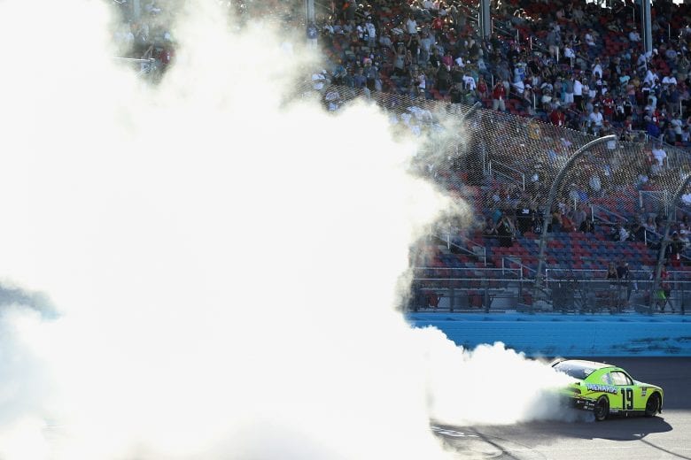 AVONDALE, ARIZONA - MARCH 07: Brandon Jones, driver of the #19 Menards/Turtle Wax Toyota, celebrates with a burn out after winning the NASCAR Xfinity Series LS Tractor 200 at Phoenix Raceway on March 07, 2020 in Avondale, Arizona. (Photo by Christian Petersen/Getty Images) | Getty Images