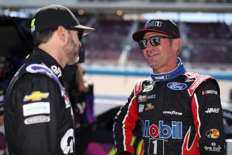 AVONDALE, ARIZONA - MARCH 07: Clint Bowyer, driver of the #14 Mobil 1/Haas CNC Ford, talks with Jimmie Johnson, driver of the #48 Ally Chevrolet, on the grid during qualifying for the NASCAR Cup Series FanShield 500 at Phoenix Raceway on March 07, 2020 in Avondale, Arizona. (Photo by Christian Petersen/Getty Images) | Getty Images