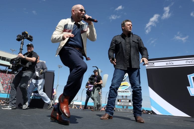 AVONDALE, ARIZONA - MARCH 08: Rapper Pitbull and singer Blake Shelton perform prior to the NASCAR Cup Series FanShield 500 at Phoenix Raceway on March 08, 2020 in Avondale, Arizona. (Photo by Christian Petersen/Getty Images) | Getty Images