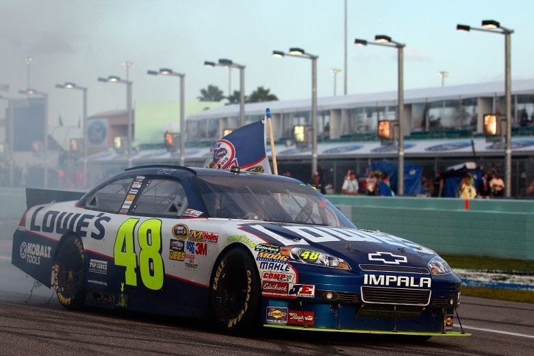 HOMESTEAD, FL - NOVEMBER 21:  Jimmie Johnson, driver of the #48 Lowe's Chevrolet, celebrates after finishing in second place in the Ford 400 to clinch a fifth consecutive NASCAR Sprint Cup championship at Homestead-Miami Speedway on November 21, 2010 in Homestead, Florida.  (Photo by Chris Graythen/Getty Images) | Getty Images