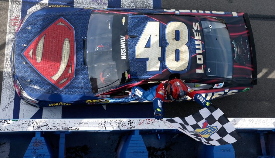 FONTANA, CA - MARCH 20:  Jimmie Johnson, driver of the #48 Lowe's / Superman Chevrolet, celebrates after taking the checkered flag during the NASCAR Sprint Cup Series Auto Club 400 at Auto Club Speedway on March 20, 2016 in Fontana, California.  (Photo by Brian Lawdermilk/NASCAR via Getty Images)