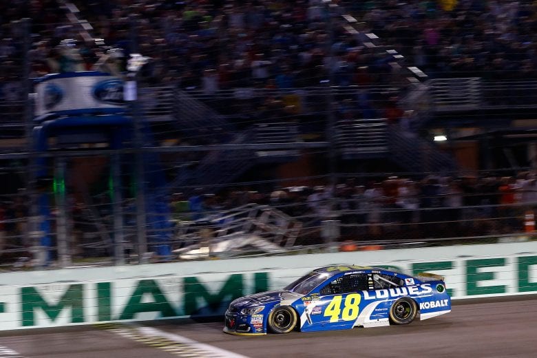 HOMESTEAD, FL - NOVEMBER 20:  Jimmie Johnson, driver of the #48 Lowe's Chevrolet, takes the checkered flag to win the NASCAR Sprint Cup Series Ford EcoBoost 400 and the 2016 NASCAR Sprint Cup Series Championship at Homestead-Miami Speedway on November 20, 2016 in Homestead, Florida.  (Photo by Jonathan Ferrey/NASCAR via Getty Images)