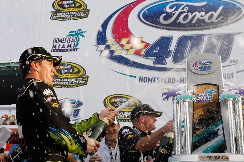 HOMESTEAD, FL - NOVEMBER 21: Carl Edwards, driver of the #99 Aflac Ford, celebrates after winning the NASCAR Sprint Cup Series Ford 400 at Homestead-Miami Speedway on November 21, 2010 in Homestead, Florida. (Photo by Chris Trotman/Getty Images for NASCAR) | Getty Images