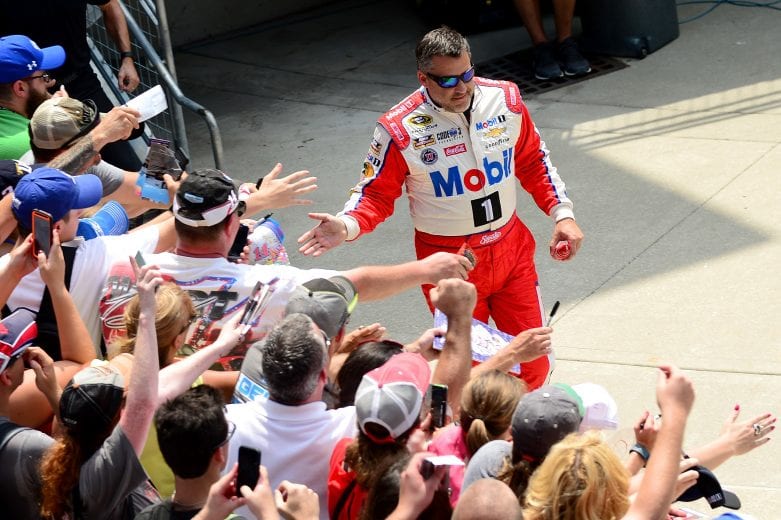 INDIANAPOLIS, IN - JULY 24:  Tony Stewart, driver of the #14 Mobil 1/Chevy Summer Sell Down Chevrolet, waves to fans prior to the NASCAR Sprint Cup Series Crown Royal Presents the Combat Wounded Coalition 400 at Indianapolis Motor Speedway on July 24, 2016 in Indianapolis, Indiana.  (Photo by Jeff Curry/NASCAR via Getty Images)