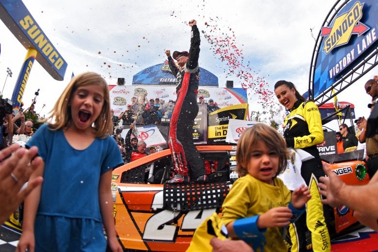 DOVER, DE - SEPTEMBER 28: Jeff Gordon, driver of the #24 Drive To End Hunger Chevrolet, celebrates in Victory Lane with his children Ella and Leo after winning the NASCAR Sprint Cup Series AAA 400 at Dover International Speedway on September 28, 2014 in Dover, Delaware. (Photo by Patrick Smith/Getty Images) | Getty Images