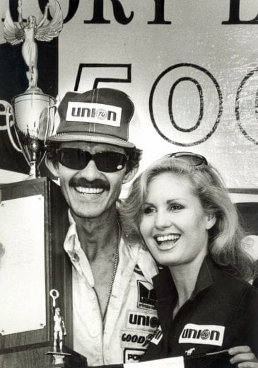 DOVER, DE - MAY 20:  Richard Petty #42 celebrates with Miss Winston in victory lane. Petty would take home $28,105 for the win and 180 points on May 20, 1984. (Photo by Racing Photo Archives/Getty Images)