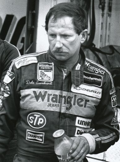 DOVER, DE - SEPTEMBER 20:  Dale Earnhardt has a Gatorade while watching his crew work on his car.  Earnhardt had engine problems on the 304th lap causing him to stop for the day.  (Photo by Racing Photo Archives/Getty Images)