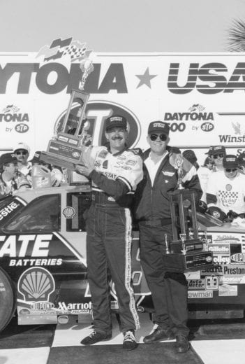 DAYTONA BEACH, FL - FEBRUARY 14, 1993:  Daytona 500 winner Dale Jarrett (left) celebrates alongside team owner and former NFL Super Bowl winning head coach, Joe Gibbs.  (Photo by ISC Archives/CQ-Roll Call Group via Getty Images)