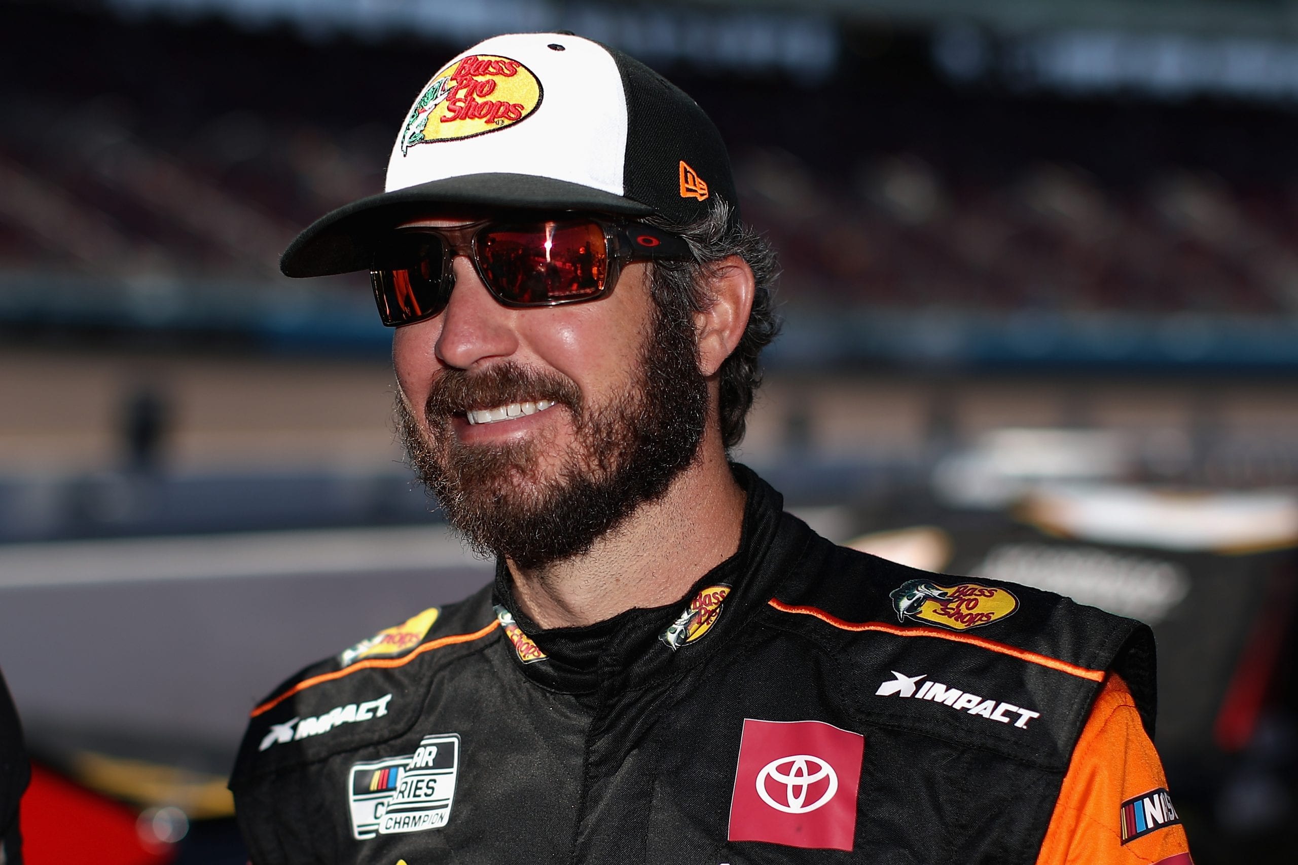 AVONDALE, ARIZONA - MARCH 07: Martin Truex Jr., driver of the #19 Bass Pro Shops Toyota, stands on the grid during qualifying for the NASCAR Cup Series FanShield 500 at Phoenix Raceway on March 07, 2020 in Avondale, Arizona. (Photo by Christian Petersen/Getty Images) | Getty Images