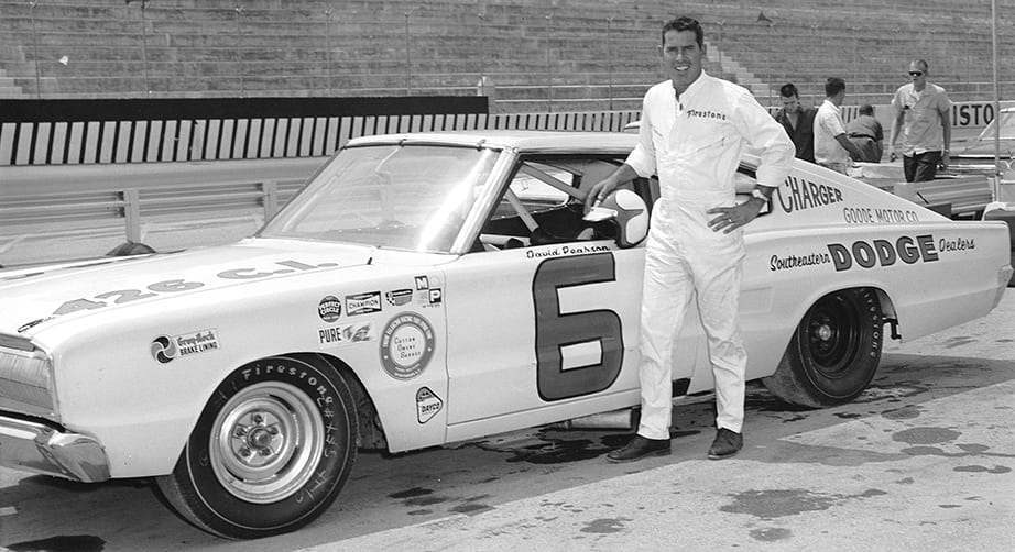 BRISTOL, TN - 1966: David Pearson poses with his Cotton Owens-owned Dodge Charger at Bristol International Speedway. Pearson went on to win his first of three NASCAR Cup titles, winning 15 races during the year. (Photo by ISC Images & Archives via Getty Images)