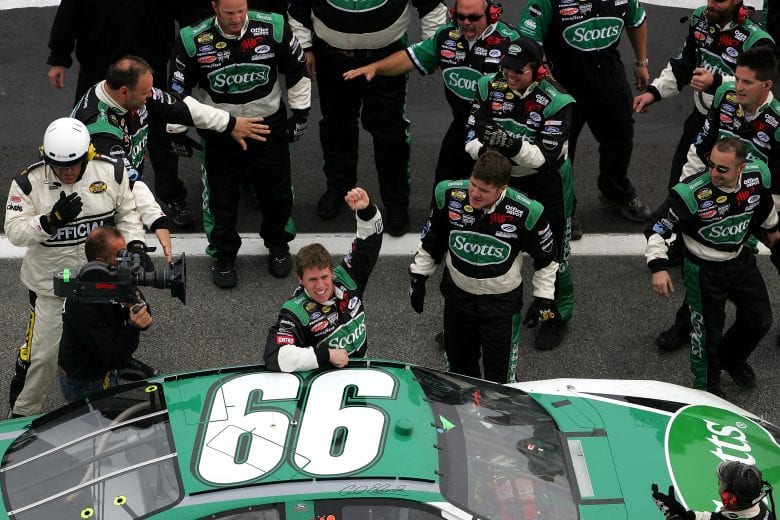 HAMPTON, GA - MARCH 20: Carl Edwards, driver of the #99 Roush Racing Ford, is congratulated by teammates after winning the NASCAR Nextel Cup Golden Corral 500 on March 20, 2005 at the Atlanta Motor Speedway in Hampton, Georgia. (Photo by Jamie Squire/Getty Images) | Getty Images