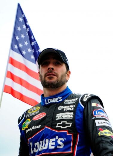 DOVER, DE - MAY 15: Jimmie Johnson, driver of the #48 Lowe's Chevrolet, stands on the grid prior to the NASCAR Sprint Cup Series FedEx 400 Benefiting Autism Speaks at Dover International Speedway on May 15, 2011 in Dover, Delaware. (Photo by Jason Smith/Getty Images for NASCAR) | Getty Images