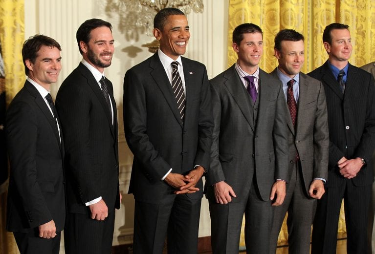 WASHINGTON, DC - SEPTEMBER 07: U.S. President Barack Obama (3rd L) poses for a group picture with NASCAR drivers (L-R) Jeff Gordon, Jimmie Johnson, Denny Hamlin, Matt Kenseth, and Kurt Busch during an East Room event September 7, 2011 at the White House in Washington, DC. Obama hosted the 2010 NASCAR Sprint Cup Series Champion Jimmie Johnson to honor his win. Johnson is the only driver in the NASCAR history to win in five consecutive years. (Photo by Alex Wong/Getty Images) | Getty Images
