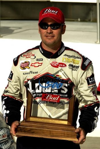 9 Feb 2002: Jimmie Johnson, driver of the #48 Lowe's Chevrolet Monte Carlo, holds the BUD pole award after winning qualifying for the Daytona 500 at Daytona International Speedway in Daytona, Florida. Digital Image. Mandatory Credit: Craig Jones/Getty Images