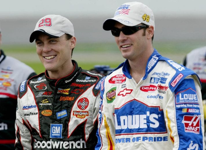 CONCORD, NC - MAY 23: Kevin Harvick, driver of the #29 Goodwrench Cheverolet, shares a laugh with Jimmie Johnson, driver of the #48 Lowe's Chevrolet, during practice for the Coca-Cola 600 on May 23, 2003 at Lowe's Motor Speedway in Concord, North Carolina. (Photo by Craig Jones/Getty Images) | Getty Images