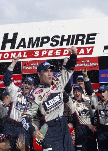 LOUDON, NH - SEPTEMBER 14: Jimmie Johnson driver of the #48 Hendrick Motorsport Lowes Chevrolet celebrates winning the NASCAR Winston Cup Sylvania 300 at the New Hampshire International Speedway on September 14, 2003 in Loudon, New Hampshire. (Photo by Darrell Ingham/Getty Images) | Getty Images
