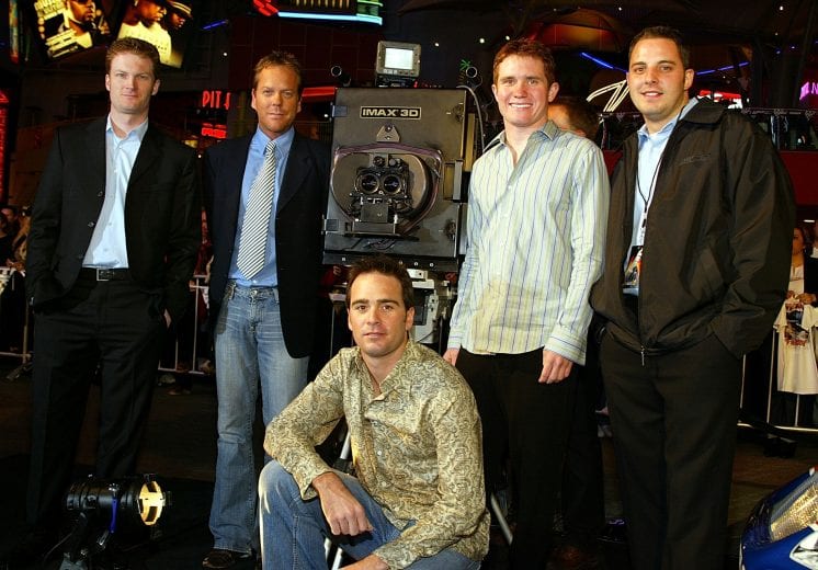LOS ANGELES - MARCH 3: (L to R) Dale Earnhardt Jr., Kiefer Sutherland, Jimmie Johnson, Brian Vickers, Johnny Sauter pose with the IMAX 3D camera for the premiere of Warner Brothers 'NASCAR 3D: The Imax Experiance' at Universal Studios City Walk March 3, 2004 in Los Angeles, CA. (Photo by Carlo Allegri/Getty Images) | Getty Images