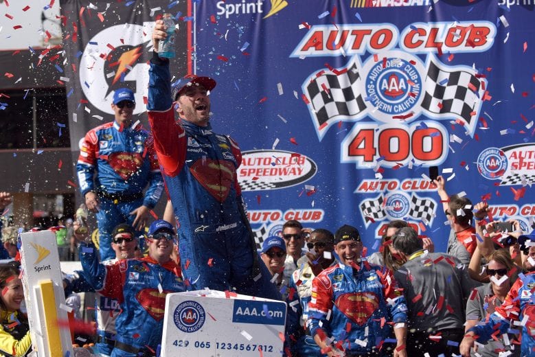 FONTANA, CA - MARCH 20: Jimmie Johnson, driver of the #48 Lowe's / Superman Chevrolet, celebrates in victory lane after winning the NASCAR Sprint Cup Series Auto Club 400 at Auto Club Speedway on March 20, 2016 in Fontana, California. (Photo by Jonathan Moore/Getty Images) | Getty Images