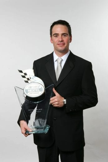 NEW YORK - DECEMBER 3: Jimmie Johnson poses with his 2nd place driver award at the 2004 NASCAR Nextel Cup Awards at the Waldorf Astoria on December 3, 2004 in New York City. (Photo by Jamie Squire/Getty Images for NASCAR) | Getty Images