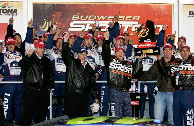 DAYTONA BEACH, FL - FEBRUARY 12: Jimmie Johnson, driver of the #48 Hendrick Motorsports Lowe's Chevrolet, celebrates with teammates after winning the Bud Shootout in the NASCAR Nextel Cup Daytona 500 on February 12, 2005 at the Daytona International Speedway in Daytona, Florida. (Photo By Streeter Lecka/Getty Images) | Getty Images