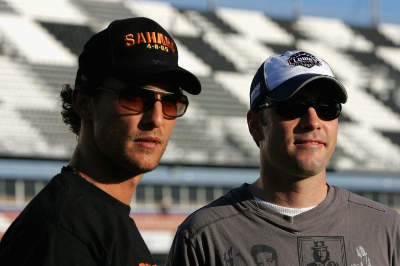 DAYTONA BEACH, FL - FEBRUARY 19: Matthew McConaughey (L) and NASCAR driver Jimmie Johnson talk things over before their drive around Daytona International Speedway before the NASCAR Nextel Cup Daytona 500 on February 19, 2005 at the Daytona International Speedway in Daytona, Florida. (Photo By Streeter Lecka/Getty Images) | Getty Images