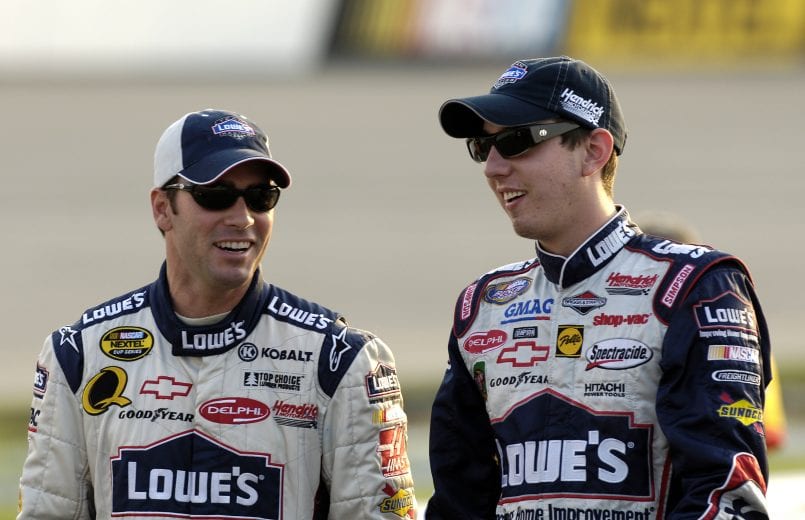 RICHMOND, VA - SEPTEMBER 9: Jimmie Johnson (L), driver of the #48 Lowe's Chevrolet, talks with Kyle Busch, driver of the #5 Kellogg's/Delphi Chevrolet, during qualifying for the NASCAR Nextel Series Chevy Rock & Roll 400 on September 9, 2005 at Richmond International Speedway in Richmond, Virginia. (Photo by Rusty Jarrett/Getty Images) | Getty Images
