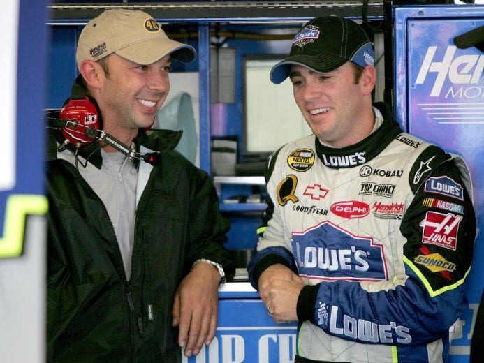 LONG POND, PA - JUNE 09: Jimmie Johnson, (R) driver of the #48 Lowe's Chevrolet talks with his crew chief Chad Knaus (L) during practice for the NASCAR Nextel Cup Series Pocono 500 at the Pocono Raceway on June 9, 2006 in Long Pond, Pennsylvania. (Photo by Doug Pensinger/Getty Images) | Getty Images
