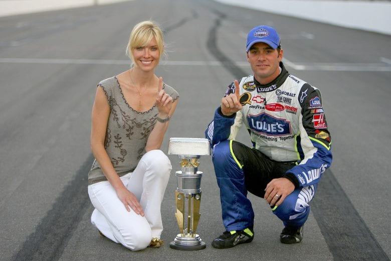 INDIANAPOLIS - AUGUST 06: Jimmie Johnson, driver of the #48 Lowe's Chevrolet, poses with his wife Chandra after winning the NASCAR Nextel Cup Series Allstate 400 at the Brickyard on August 6, 2006 at Indianapolis Motor Speedway in Indianapolis, Indiana. (Photo by Rusty Jarrett/Getty Images for NASCAR) | Getty Images
