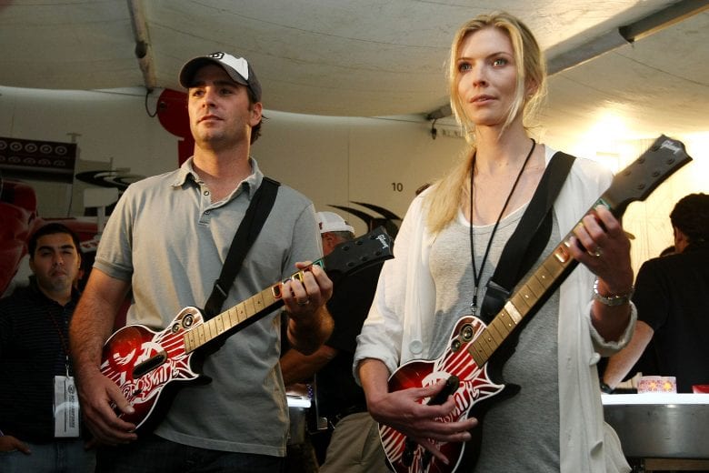 LOUDON, NH - JUNE 28: Nascar driver Jimmie Johnson and wife Chandra play Guitar Hero: Aerosmith at the Target Chip Ganassi Racing hospitality tent on June 28, 2008 at New Hampshire Motor Speedway in Loudon, New Hampshire. (Photo by Chris McGrath/Getty Images for NASCAR) | Getty Images