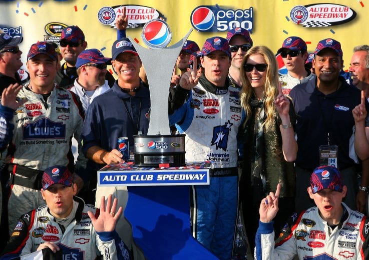 FONTANA, CA - OCTOBER 11: Jimmie Johnson, driver of the #48 Lowe's Chevrolet, celebrates in victory lane after winning the NASCAR Sprint Cup Series Pepsi 500 at Auto Club Speedway on October 11, 2009 in Fontana, California. (Photo by Jason Smith/Getty Images for NASCAR) | Getty Images