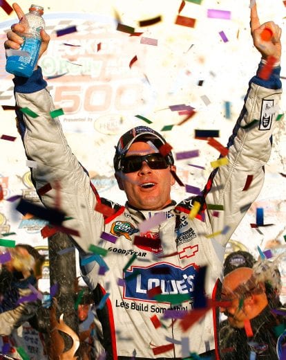 AVONDALE, AZ - NOVEMBER 15: Jimmie Johnson, driver of the #48 Lowe's Chevrolet, celebrates in victory lane after winning the NASCAR Sprint Cup Series Checker O'Reilly Auto Parts 500 at Phoenix International Raceway on November 15, 2009 in Avondale, Arizona. (Photo by Jason Smith/Getty Images for NASCAR) | Getty Images