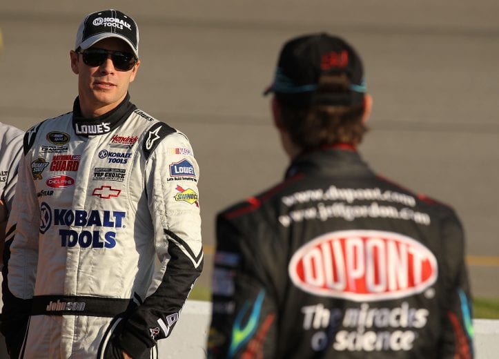 RICHMOND, VA - APRIL 30: Jimmie Johnson (L), driver of #48 Lowe's / Kobalt tools Chevrolet speaks to Jeff Gordon, driver of #24 Dupont Chevrolet on the grid during qualifying for the NASCAR Sprint Cup Series CROWN ROYAL Presents the Heath Calhoun 400 at Richmond International Raceway on April 30, 2010 in Richmond, Virginia. (Photo by Al Bello/Getty Images) | Getty Images