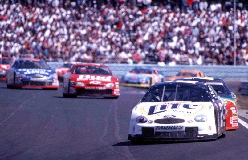 Pole position winner Rusty Wallace leads a pack of cars in the Frontier at the Glen Winston Cup race in Watkins Glen, New York August 15, 1999. The race was eventually won by Jeff Gordon. (Photo by Brian Cleary/Getty Images)
